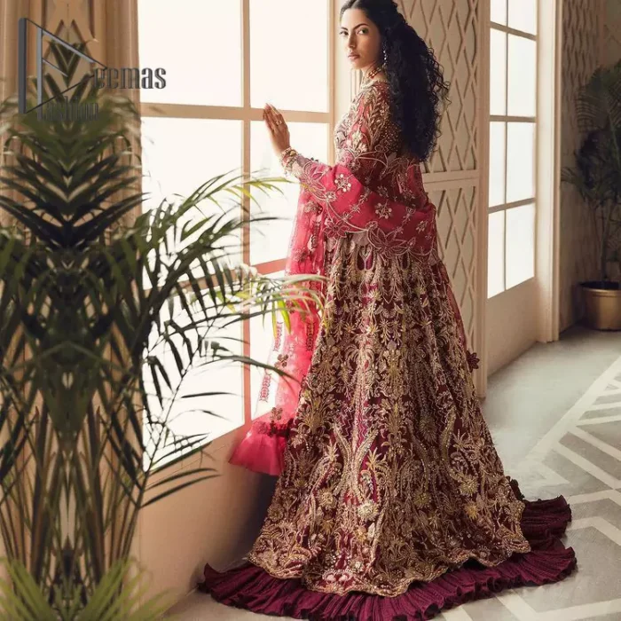 Create your own uniqueness. Let it be priceless for yourself and yet identifiable for others. Introducing burgundy blouse which is heavily adorned with golden embroidery that includes kora, doabka and magic of tilla. It is enhanced with the round shape neckline and full sleeves to make your remarkable moments lovely and a little romantic. Furthermore, it is systemized with a frilled lehenga that is again embellished with heavy embroidery. Finish this outfit with a scalloped dupatta in the same colour that is ornamented with a four-sided border to make you the priceless bride. 