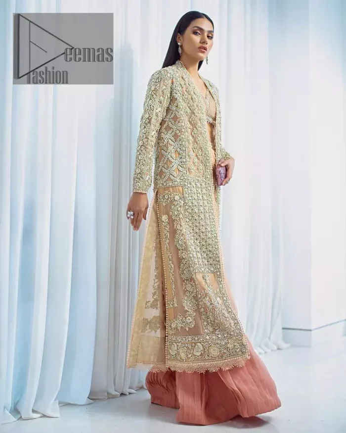 It's all about the colour you wear. Feel yourself in the fawn colour so stunning and adorable. Starting this article with a fawn blouse that is slightly embellished with silver embroidery and the V shape neckline of the blouse added super beauty to the article. It is handsomely organized with a front open long shirt which is prominent with silver embroidery that contains tilla, kora, dabka and crystals. The full sleeves of the long shirt raise the feeling of pleasure in any event. Complete this article with crushed sharara that is highlighted with two-tone colours.