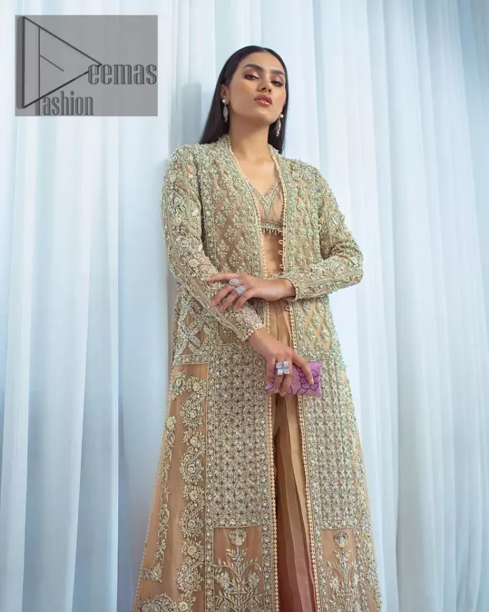 It's all about the colour you wear. Feel yourself in the fawn colour so stunning and adorable. Starting this article with a fawn blouse that is slightly embellished with silver embroidery and the V shape neckline of the blouse added super beauty to the article. It is handsomely organized with a front open long shirt which is prominent with silver embroidery that contains tilla, kora, dabka and crystals. The full sleeves of the long shirt raise the feeling of pleasure in any event. Complete this article with crushed sharara that is highlighted with two-tone colours.