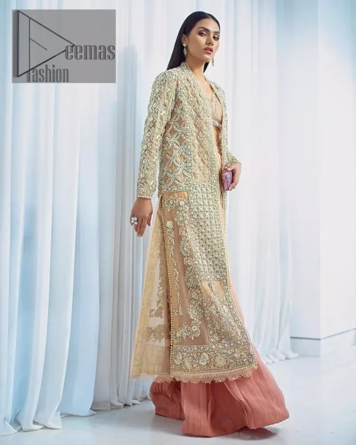 It's all about the colour you wear. Feel yourself in the fawn colour so stunning and adorable. Starting this article with a fawn blouse that is slightly embellished with silver embroidery and the V shape neckline of the blouse added super beauty to the article. It is handsomely organized with a front open long shirt which is prominent with silver embroidery that contains tilla, kora, dabka and crystals. The full sleeves of the long shirt raise the feeling of pleasure in any event. Complete this article with crushed sharara that is highlighted with two-tone colours.