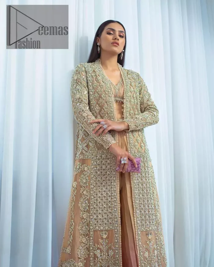 It's all about the colour you wear. Feel yourself in the fawn colour so stunning and adorable. Starting this article with a fawn blouse that is slightly embellished with silver embroidery and the V shape neckline of the blouse added super beauty to the article. It is handsomely organized with a front open long shirt which is prominent with silver embroidery that contains tilla, kora, dabka and crystals. The full sleeves of the long shirt raise the feeling of pleasure in any event. Complete this article with crushed sharara that is highlighted with two-tone colours.