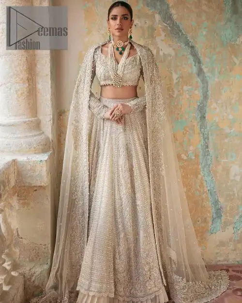 With a touch of Divine. A stunning ivory blouse is laboriously frosted with meticulously detailed hand embellishment with kora, dabka,