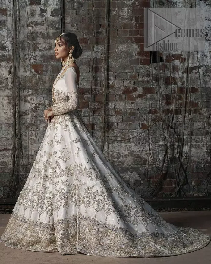 Back train is a dreamy silhouette designed to highlight you like the dazzling jewel on your walima day. The back train of ivory white maxi is beautifully embellished with silver and golden embroidery which includes kora, dabka, and sequins work. Further, it is prominent with full sleeves and boat shape neckline just to enhance the attractiveness of this ivory white maxi. It is paired up with the same colour dupatta that is adorned with a four-sided embellished border and combined with sequins spray all over just to complete your dreamy look on your Walima. 