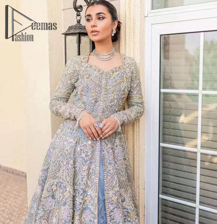 Something to blue about!. Trust on DeemasFashion to bring the magic of light blue colour for you on your walima day. Starting this outfit with a light blue front open maxi which is appealing with silver embroidery. The embroidery is further prominent with tilla, kora, zardozi and pearls work to raise the loveliness of the outfit. It is paired up with a full frilled lehenga that is designed just to express the feelings of a dreamy fairy on your Walima day. Complete this light blue outfit with the same colour scallop[ed dupatta that is adorned with a four-sided embellished border and sequins spray all over. 