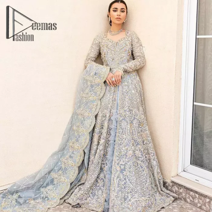 Something to blue about!. Trust on DeemasFashion to bring the magic of light blue colour for you on your walima day. Starting this outfit with a light blue front open maxi which is appealing with silver embroidery. The embroidery is further prominent with tilla, kora, zardozi and pearls work to raise the loveliness of the outfit. It is paired up with a full frilled lehenga that is designed just to express the feelings of a dreamy fairy on your Walima day. Complete this light blue outfit with the same colour scallop[ed dupatta that is adorned with a four-sided embellished border and sequins spray all over. 