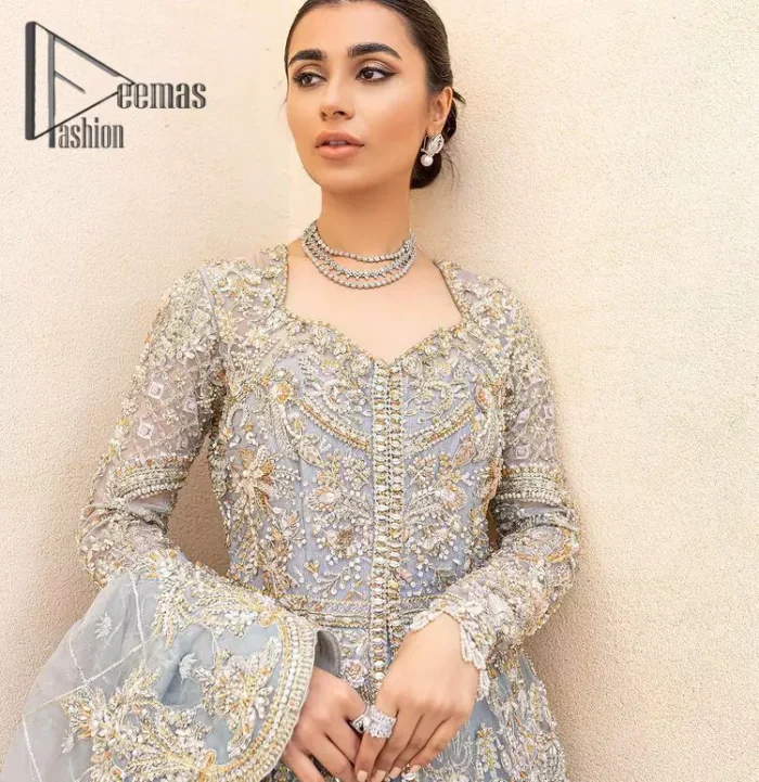 Something to blue about!. Trust on DeemasFashion to bring the magic of light blue colour for you on your walima day. Starting this outfit with a light blue front open maxi which is appealing with silver embroidery. The embroidery is further prominent with tilla, kora, zardozi and pearls work to raise the loveliness of the outfit. It is paired up with a full frilled lehenga that is designed just to express the feelings of a dreamy fairy on your Walima day. Complete this light blue outfit with the same colour scallop[ed dupatta that is adorned with a four-sided embellished border and sequins spray all over. 