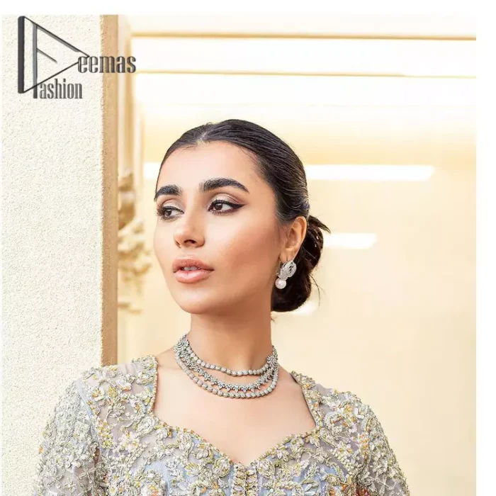 Something to blue about!. Trust on DeemasFashion to bring the magic of light blue colour for you on your walima day. Starting this outfit with a light blue front open maxi which is appealing with silver embroidery. The embroidery is further prominent with tilla, kora, zardozi and pearls work to raise the loveliness of the outfit. It is paired up with a full frilled lehenga that is designed just to express the feelings of a dreamy fairy on your Walima day. Complete this light blue outfit with the same colour scallop[ed dupatta that is adorned with a four-sided embellished border and sequins spray all over. 