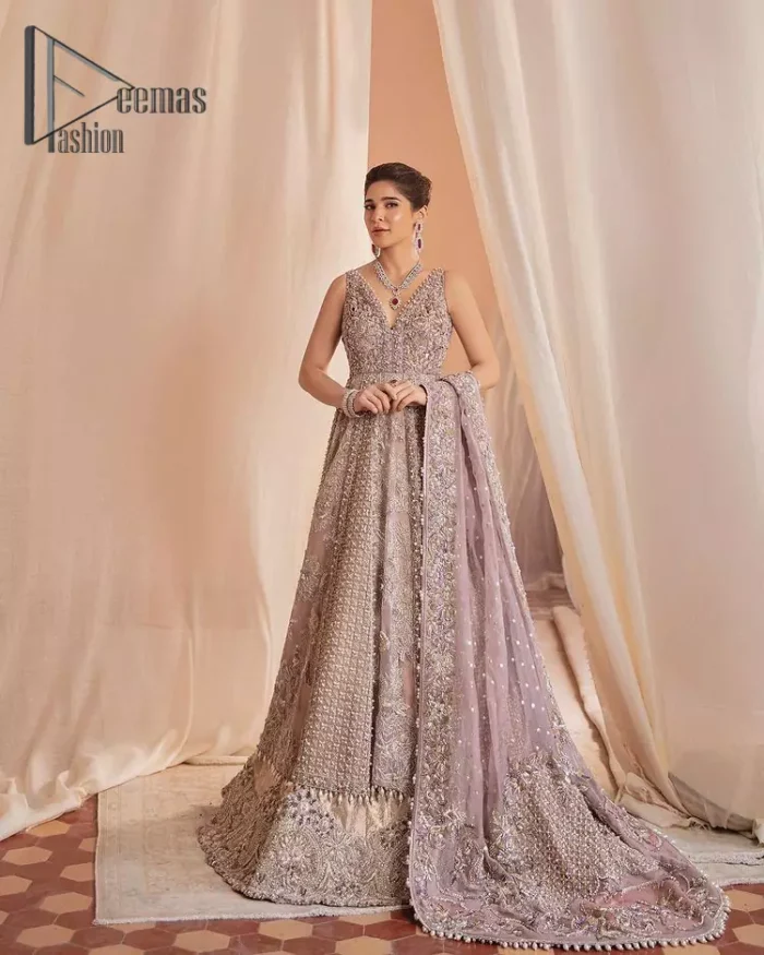 We know for most the girls a wedding dress represents more than just love. For our real brides, we present a lilac multiple panel maxi which is the embodiment of a dream and beautifully embellished with silver tilla, dabka and kora work. Furthermore, the sleeveless style of this multiple panel maxi is super amazing with V shape neckline just to introduce our love for the brides. This lilac maxi is organized with golden lehenga just to give the contrast to your walima day which is embellished with embroidery. Finish this look with a lilac dupatta which is heavily embellished with a four-sided border and sequins sprayed all over.