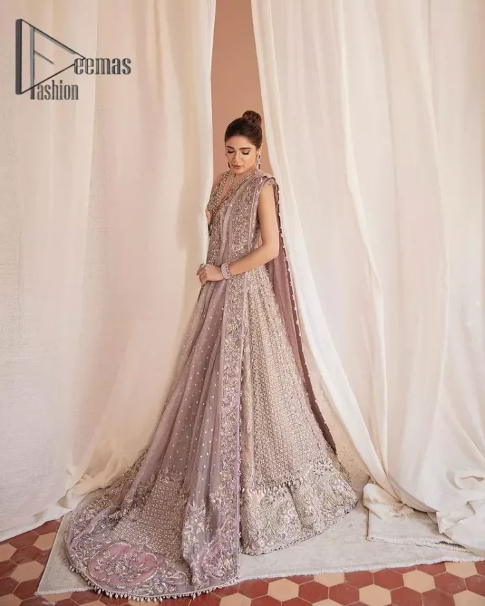 We know for most the girls a wedding dress represents more than just love. For our real brides, we present a lilac multiple panel maxi which is the embodiment of a dream and beautifully embellished with silver tilla, dabka and kora work. Furthermore, the sleeveless style of this multiple panel maxi is super amazing with V shape neckline just to introduce our love for the brides. This lilac maxi is organized with golden lehenga just to give the contrast to your walima day which is embellished with embroidery. Finish this look with a lilac dupatta which is heavily embellished with a four-sided border and sequins sprayed all over.