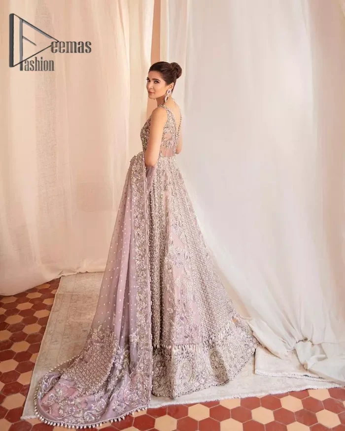 We know for most the girls a wedding dress represents more than just love. For our real brides, we present a lilac multiple panel maxi which is the embodiment of a dream and beautifully embellished with silver tilla, dabka and kora work. Furthermore, the sleeveless style of this multiple panel maxi is super amazing with V shape neckline just to introduce our love for the brides. This lilac maxi is organized with golden lehenga just to give the contrast to your walima day which is embellished with embroidery. Finish this look with a lilac dupatta which is heavily embellished with a four-sided border and sequins sprayed all over.