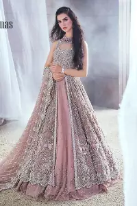 Rose, glitter, and glam are the mood. Shine through with all eyes on you! A full festive package dipped in an oyster pink tone. Presenting oyster pink front open maxi for your Walima day just to boost up your inner happiness. The maxi is handsomely adorned with silver embroidery that is embellished with tilla, kora, dabka, and pearls work. Furthermore, it is highlighted with full sleeves just to give you glam and shiny look. It is systemized with an oyster pink lehenga to give you a superstar look. End up this article with the same colour dupatta that is prominent with a four-sided embellished border and sequins spray all over.