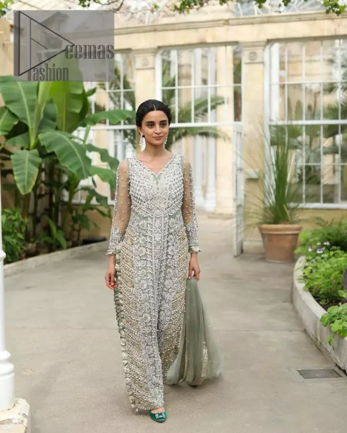 The subtle but powerful action.DeemasFashion presents pastel green outfits just to grant you modern, light and easy-breezy vibes at any party. The floor-length shirt of this article is attractively adorned with silver embroidery which is highlighted with kora, dabka, tilla and crystal work. In addition to this, the V shape neckline and full sleeves enhance the beauty of the article as you are the star of the party.  it is coordinated with the same colour plain trouser that balances the look of the article. Finish this pastel green dress with the same colour dupatta that is adorned with sequins spray all over as you can steal everyone's heart on any occasion. 
