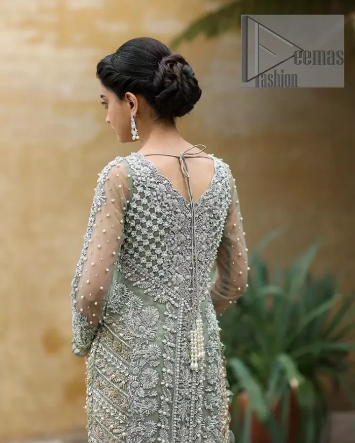 The subtle but powerful action.DeemasFashion presents pastel green outfits just to grant you modern, light and easy-breezy vibes at any party. The floor-length shirt of this article is attractively adorned with silver embroidery which is highlighted with kora, dabka, tilla and crystal work. In addition to this, the V shape neckline and full sleeves enhance the beauty of the article as you are the star of the party.  it is coordinated with the same colour plain trouser that balances the look of the article. Finish this pastel green dress with the same colour dupatta that is adorned with sequins spray all over as you can steal everyone's heart on any occasion. 