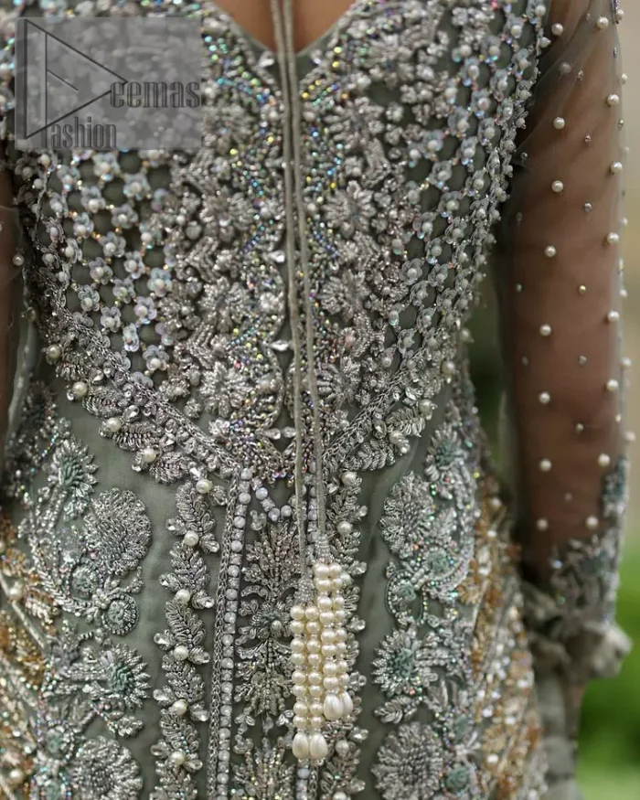 The subtle but powerful action.DeemasFashion presents pastel green outfits just to grant you modern, light and easy-breezy vibes at any party. The floor-length shirt of this article is attractively adorned with silver embroidery which is highlighted with kora, dabka, tilla and crystal work. In addition to this, the V shape neckline and full sleeves enhance the beauty of the article as you are the star of the party.  it is coordinated with the same colour plain trouser that balances the look of the article. Finish this pastel green dress with the same colour dupatta that is adorned with sequins spray all over as you can steal everyone's heart on any occasion. 