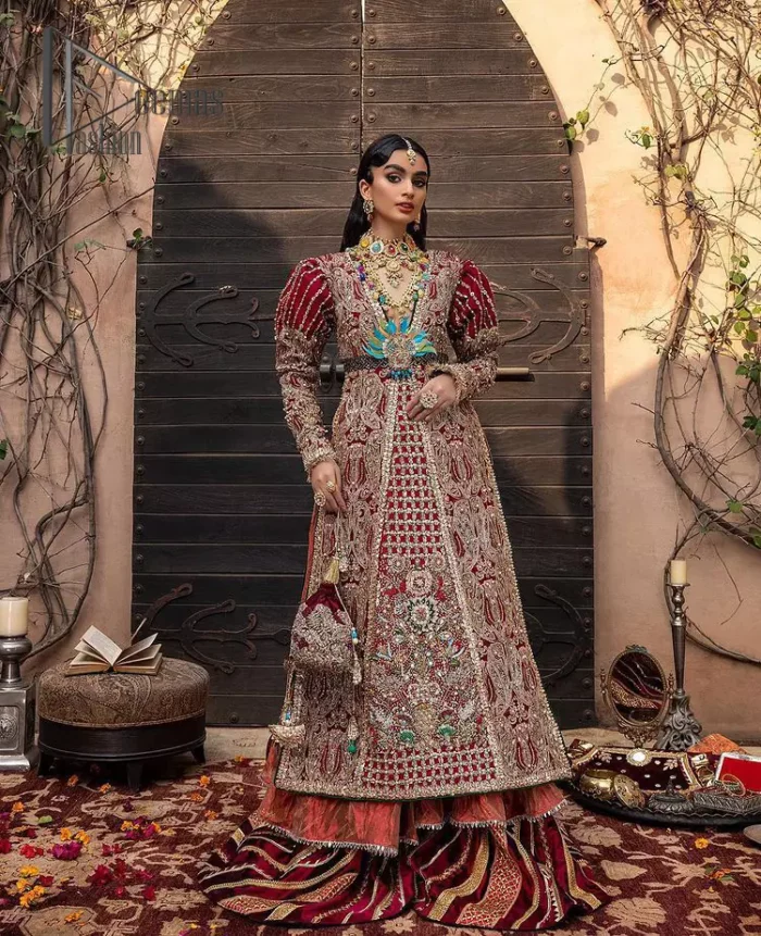 Look in my eyes, look how they shine for you and everything you do. DeemasFashion presents a very traditional outfit for the brides to wear the article on their Big Day. The traditional red long shirt is hand-rendered in silver and is enhanced with Resham, tilla, pearls, Sitara and naqshi. The V shape neckline and full sleeves added some magic and a dramatic look to the bride. Further, it is prominent with a blue heavy floral motif that is placed at the centre. The long shirt is organized with crushed share that truly defines the love and laughter of a bride. 