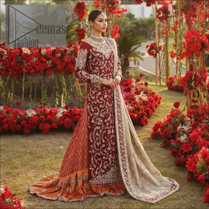 She's headstrong and rebellious, determined to divert the pacts of tradition on her Big day. Presenting a Red long shirt of DeemasFashion which is attractively ornamented with silver embroidery which involves kora, dabka, and zardozi work. It is especially highlighted with full sleeves which enhance the charmless of the article when combine with boat shape neckline. Pair up with an orange back train lehenga which is made up of pure jamawar that gives a super aesthetic and traditional look to every bride. End up this lovely look with a light golden dupatta which is embellished with a four-sided border just to fulfil the traditional gentle look. 