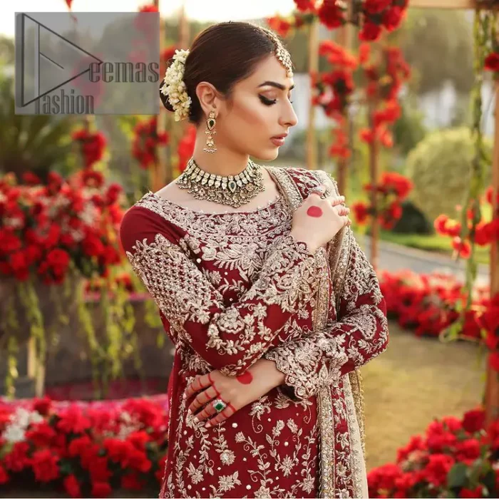 She's headstrong and rebellious, determined to divert the pacts of tradition on her Big day. Presenting a Red long shirt of DeemasFashion which is attractively ornamented with silver embroidery which involves kora, dabka, and zardozi work. It is especially highlighted with full sleeves which enhance the charmless of the article when combine with boat shape neckline. Pair up with an orange back train lehenga which is made up of pure jamawar that gives a super aesthetic and traditional look to every bride. End up this lovely look with a light golden dupatta which is embellished with a four-sided border just to fulfil the traditional gentle look. 