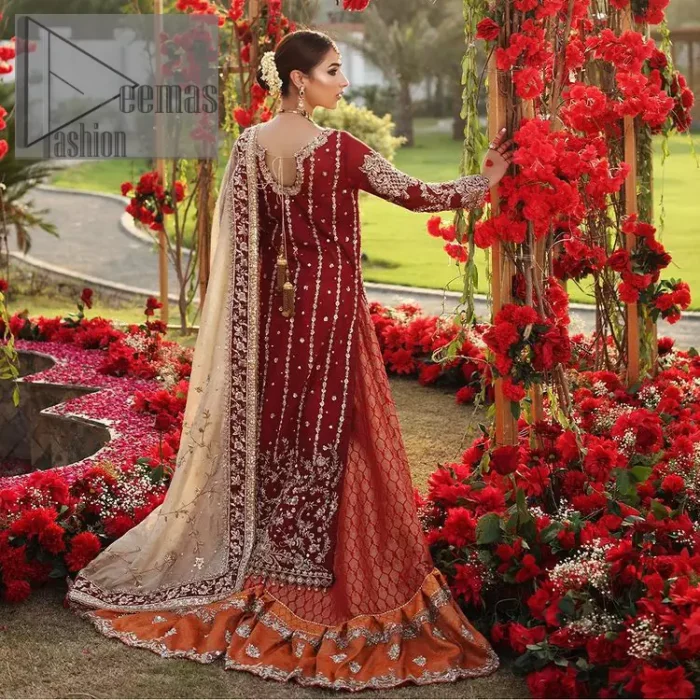 She's headstrong and rebellious, determined to divert the pacts of tradition on her Big day. Presenting a Red long shirt of DeemasFashion which is attractively ornamented with silver embroidery which involves kora, dabka, and zardozi work. It is especially highlighted with full sleeves which enhance the charmless of the article when combine with boat shape neckline. Pair up with an orange back train lehenga which is made up of pure jamawar that gives a super aesthetic and traditional look to every bride. End up this lovely look with a light golden dupatta which is embellished with a four-sided border just to fulfil the traditional gentle look. 