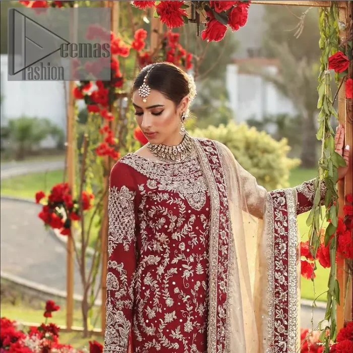 She's headstrong and rebellious, determined to divert the pacts of tradition on her Big day. Presenting a Red long shirt of DeemasFashion which is attractively ornamented with silver embroidery which involves kora, dabka, and zardozi work. It is especially highlighted with full sleeves which enhance the charmless of the article when combine with boat shape neckline. Pair up with an orange back train lehenga which is made up of pure jamawar that gives a super aesthetic and traditional look to every bride. End up this lovely look with a light golden dupatta which is embellished with a four-sided border just to fulfil the traditional gentle look. 