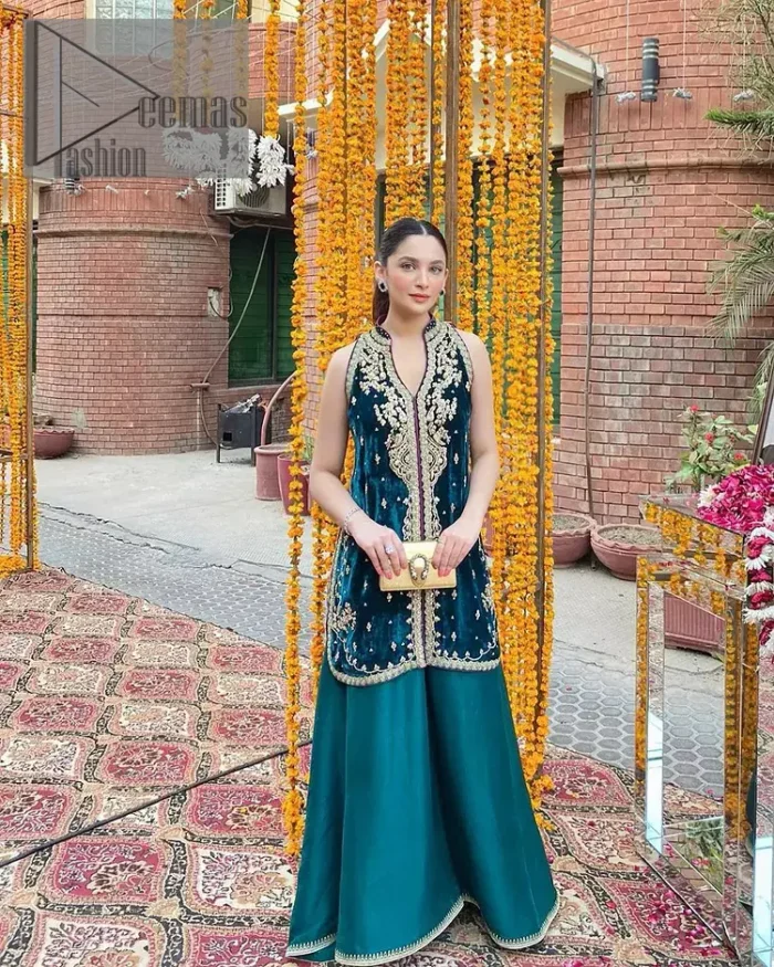 No matter the time and occasion, a pop of blue will always bring you in the bright light. This teal blue short shirt is an exquisite amalgamation of classical golden embroidery and modern cuts. It is prominent with tilla, dabka and kora so everyone looking at you in any event. The V shape neckline increases the beauty of the outfit when combined with the sleeveless style of DeemasFashion. Further, it is coordinated with the same colour palazzo pants that are the bottom line is embellished with golden tiny embroidery to enhance the brightness of your dress.