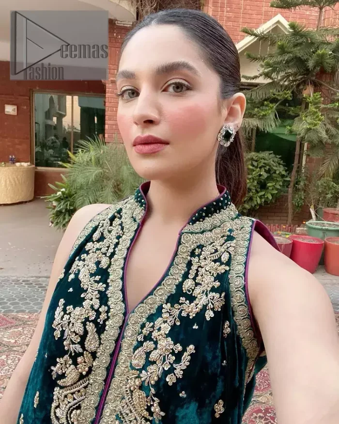 No matter the time and occasion, a pop of blue will always bring you in the bright light. This teal blue short shirt is an exquisite amalgamation of classical golden embroidery and modern cuts. It is prominent with tilla, dabka and kora so everyone looking at you in any event. The V shape neckline increases the beauty of the outfit when combined with the sleeveless style of DeemasFashion. Further, it is coordinated with the same colour palazzo pants that are the bottom line is embellished with golden tiny embroidery to enhance the brightness of your dress.
