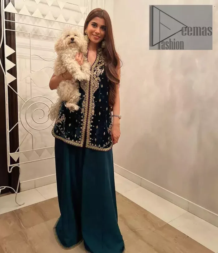 No matter the time and occasion, a pop of blue will always bring you in the bright light. This teal blue short shirt is an exquisite amalgamation of classical golden embroidery and modern cuts. It is prominent with tilla, dabka and kora so everyone looking at you in any event. The V shape neckline increases the beauty of the outfit when combined with the sleeveless style of DeemasFashion. Further, it is coordinated with the same colour palazzo pants that are the bottom line is embellished with golden tiny embroidery to enhance the brightness of your dress.