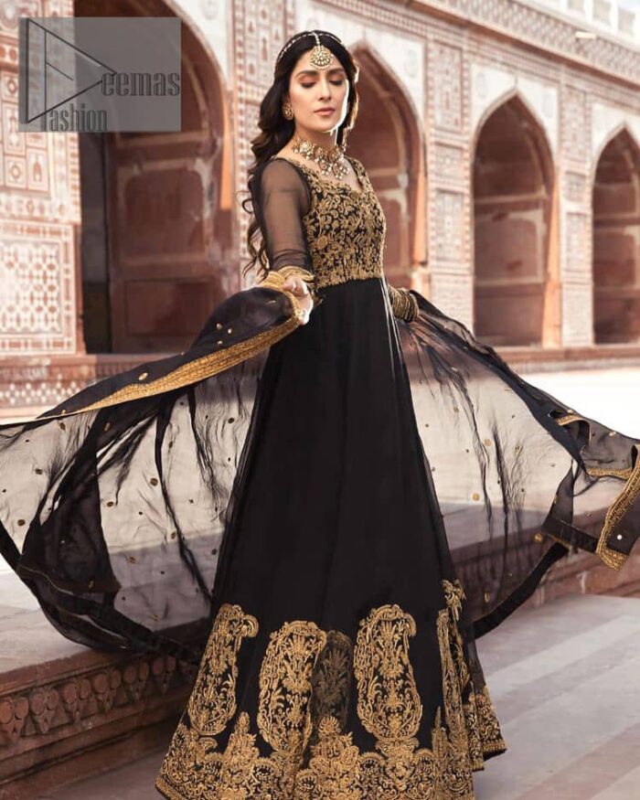 Black is just associated with a romantic evening. To make your event super dazzling and take a title of the start of the night so just go with our black can-can maxi. The body of the maxi is finished with golden embroidery which embraces golden tilla, dabka, kora and zardozi work. The full sleeves of the maxi added an astonishing vibe when paired up with the V shape neckline. Furthermore, the bottom line of the maxi is again embellished with heavy golden work. It is organized with a black dupatta which is embellished with four-sided borders and sequins sprayed all over.