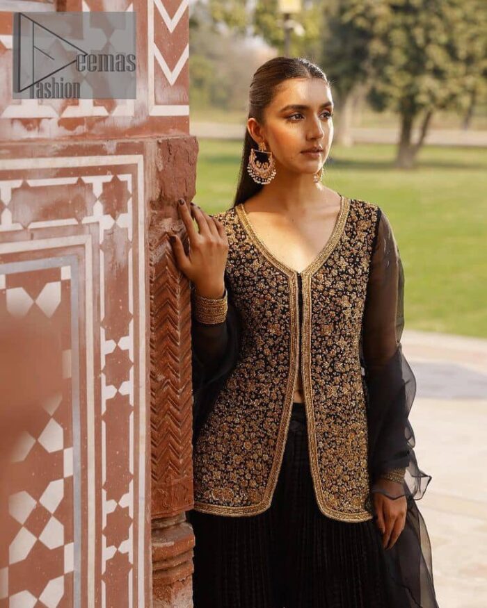 With the timeless charm of black so back on traditional flavour to steal everyone's heart. Introducing the black jacket that is the epitome of splendour with delicate details beautifully decorated with golden colour. The bodice of the jacket is enhanced with stunning embroidery with worked finishing of tilla, kora, dabka and zardozi. The addition of simple sleeves with V shape neckline can be done to make this super traditional. To complete this traditional jacket, a crushed sharara is added to give you an amazing look at any formal event. Complete this black outfit with a black dupatta in a plain style that is perfect for any intimate evening 