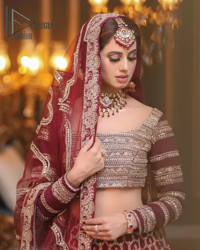 Attain your expectations on your big day with this dress. The classically vibrant combination of red and gold is a true image of elegance. Red Short Blouse - Lehanga Dupatta.