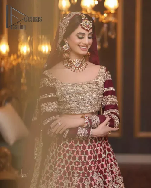 Attain your expectations on your big day with this dress. The classically vibrant combination of red and gold is a