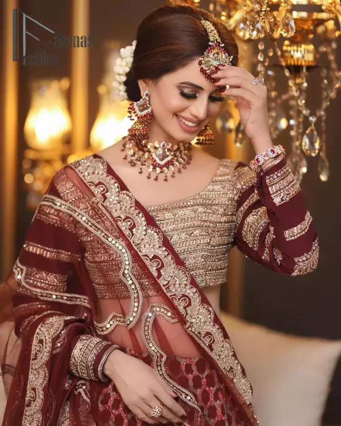 Attain your expectations on your big day with this dress. The classically vibrant combination of red and gold is a true image of elegance. Red Short Blouse - Lehanga Dupatta.