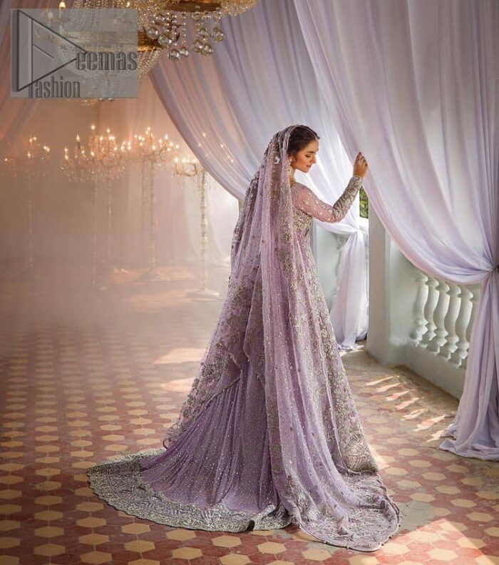 Bold instruments on a bright canvas make a true fashion statement. Introducing a lilac outfit for your Walima day to boost up your day. The front open gown in lilac colour looks as amazing as any bride's dream. It is encapsulated with silver embroidery which contains crystal, tilla, dabka, kora and sequins spray all over. In addition to this, it is highlighted with a sweetheart neckline to enhance the beauty of the gown when combined with full sleeves. It is systemized with silver barcode sharara finished with silver border embroidery that enhances the look of the bride during the day as well as night events. Complete this lilac article with a dupatta which is ornamented with four-sided borders and sequins sprayed all over. 