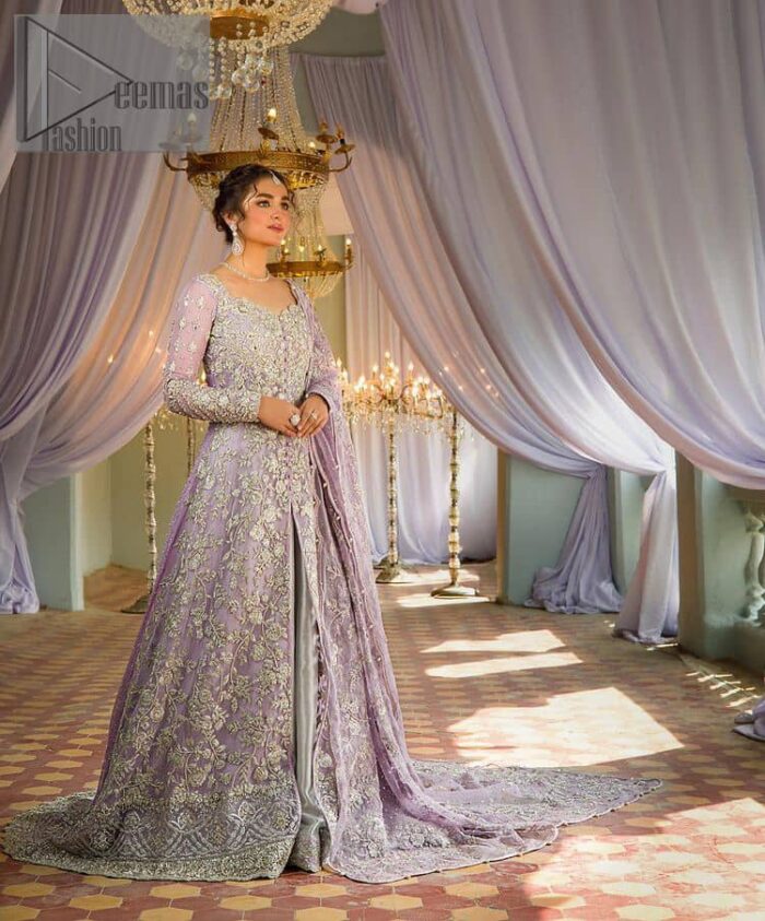 Bold instruments on a bright canvas make a true fashion statement. Introducing a lilac outfit for your Walima day to boost up your day. The front open gown in lilac colour looks as amazing as any bride's dream. It is encapsulated with silver embroidery which contains crystal, tilla, dabka, kora and sequins spray all over. In addition to this, it is highlighted with a sweetheart neckline to enhance the beauty of the gown when combined with full sleeves. It is systemized with silver barcode sharara finished with silver border embroidery that enhances the look of the bride during the day as well as night events. Complete this lilac article with a dupatta which is ornamented with four-sided borders and sequins sprayed all over. 