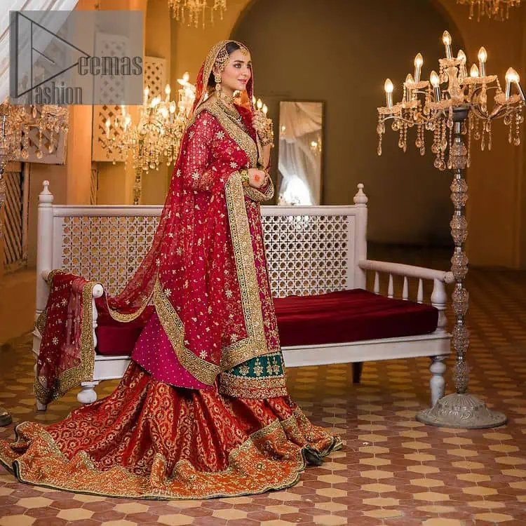 Do you also want to give you a look of the traditional brides on your Mehandi? Make your moment memorable being a queen in our magenta front open shirt with intricately embroidered neckline and embellished with delicate kora, dabka, tilla work all over. A green border of the shirt gives the perfect look to the outfit. It is organized with a red back train jamawar lehenga to give you the look of such a traditional bride. Complete this outfit with a red dupatta which is laboriously adorned with a four-sided border and ting floral motifs all over to give you such a super traditional Mehandi bride vibe.