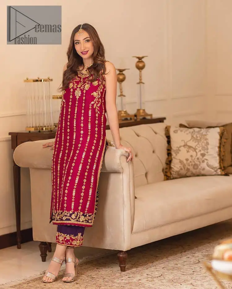 The golden pasting on a glamorous magenta canvas. The beautiful attire is presented that begins with a magenta long shirt which is attractively furnished with golden embroidery. It is spotlighted with tilla, dabka, kora and zardozi to make your event blazing and astonishing. In addition to this, it is attractively featured with a round neckline and sleeveless style. The following magenta long shirt is paired up with purple trousers that's border is again embellished with golden embroidery that gives a unique piece of style in every function.