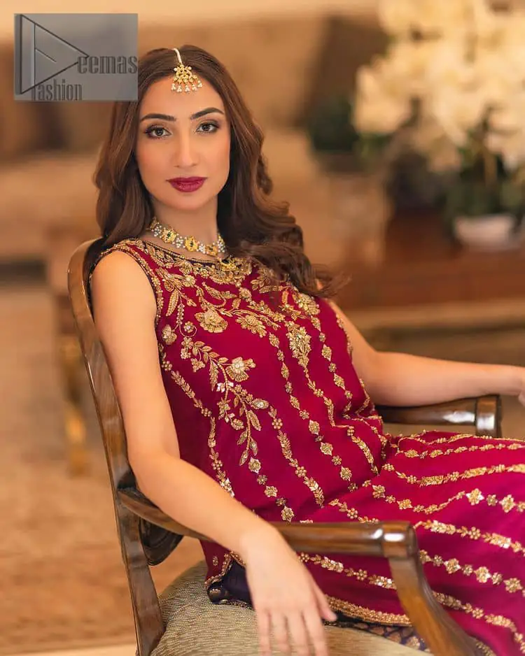 The golden pasting on a glamorous magenta canvas. The beautiful attire is presented that begins with a magenta long shirt which is attractively furnished with golden embroidery. It is spotlighted with tilla, dabka, kora and zardozi to make your event blazing and astonishing. In addition to this, it is attractively featured with a round neckline and sleeveless style. The following magenta long shirt is paired up with purple trousers that's border is again embellished with golden embroidery that gives a unique piece of style in every function.