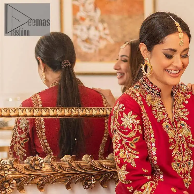 The golden pasting on a glamorous magenta canvas. The beautiful attire is presented that begins with a magenta long shirt which is attractively furnished with golden embroidery. It is spotlighted with tilla, dabka, kora and zardozi to make your event blazing and astonishing. In addition to this, it is attractively featured with a round neckline and sleeveless style. The following magenta long shirt is paired up with purple trousers that's border is again embellished with golden embroidery that gives a unique piece of style in every function.