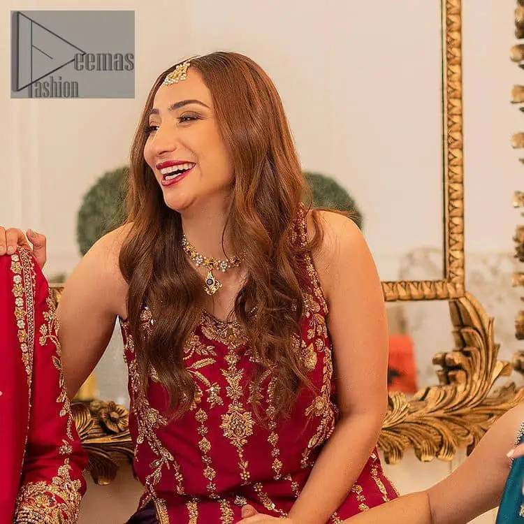 The golden pasting on a glamorous magenta canvas. The beautiful attire is presented that begins with a magenta long shirt which is attractively furnished with golden embroidery. It is spotlighted with tilla, dabka, kora and zardozi to make your event blazing and astonishing. In addition to this, it is attractively featured with a round neckline and sleeveless style. The following magenta long shirt is paired up with purple trousers that's border is again embellished with golden embroidery that gives a unique piece of style in every function.