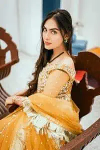 Mustard is just associated and boosts your Mehandi. Presenting a dreamy mustard frock with a heavily embroidered bodice on a silver base. The bodice is further enhanced with handwork that includes crystal, tilla, kora and dabka work. Furthermore, the boat shape neckline and tiny work on full sleeves have the super style just to boost your day. The bottom is decorated with artistic embroidery that is adding glam to it. The Mehandi look is completed with an artistically crafted frilled lehenga which frill borders displaying the traditional hint of charm. It is coordinated with a dupatta in the same colour that is embellished with four-sided borders as well.