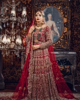 Just living is not enough, one must have sunshine, romance and a little magic on your big day as a Pakistani bridal dress. So add super magic to your big day with this Red article on DeemasFashion. This lovely red blouse that has a sweetheart neckline is fully embellished with kora, dabka and tilla embroidery. It is synchronized with a can-can lehenga that celebrates your character as well. Furthermore, this remarkable red can-can lehenga is fully embellished with golden and dark antique embroidery that gives you extraordinary beauty. As every bride prefers the right texture so we pair up this article with an organza red dupatta that has sequins spray all around that gives a delightful feeling on being bride.