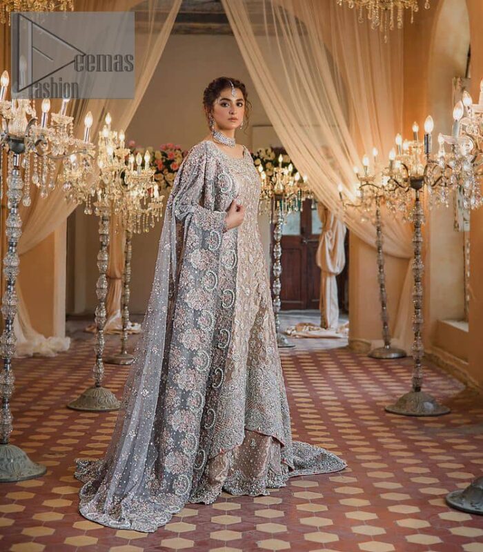 Amplify your style on your Walima day in this stunning light color. DeemasFashion presents the super handsome rose gold outfit for you. First of all, which includes back train maxi in the rose gold colour. It is prominent with the silver embroidery that is encrusted with pearls, silver crystals, kora, dabka and sequins all over highlighting floral patterns. Further, it is emphasized with boat shape neckline and full sleeves that increase the opulent statement of the outfit. It is organized with rose gold sharara which is also embellished with heavy silver embroidery to make your day super dazzling. Finish this look with the rose gold dupatta that is accentuated with sequins and booti spray all over and adorned with a four-sided matha Patti border. 