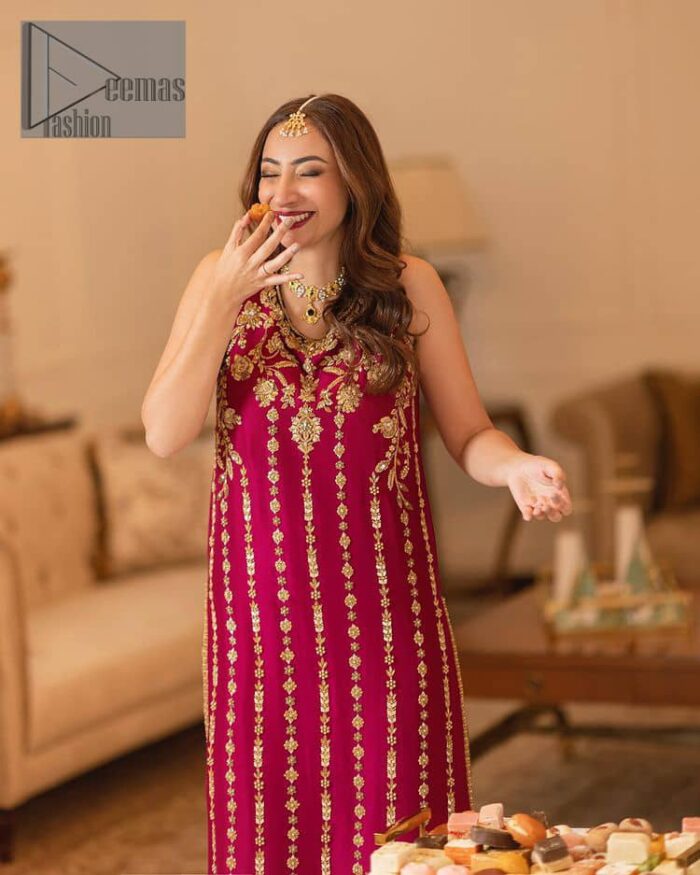 The golden pasting on a glamorous magenta canvas. The beautiful attire is presented that begins with a magenta long shirt which is attractively furnished with golden embroidery. It is spotlighted with tilla, dabka, kora and zardozi to make your event blazing and astonishing. In addition to this, it is attractively featured with a round neckline and sleeveless style. The following magenta long shirt is paired up with purple trousers that's border is again embellished with golden embroidery that gives a unique piece of style in every function.