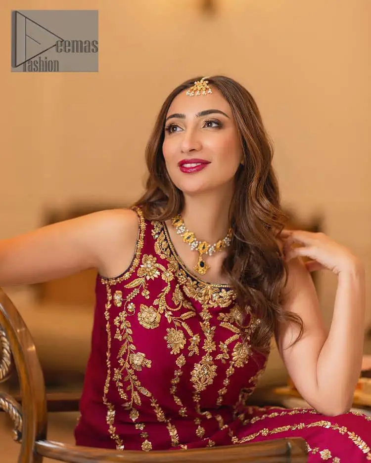 The golden pasting on a glamorous magenta canvas. The beautiful attire is presented that begins with a magenta long shirt which is attractively furnished with golden embroidery. It is spotlighted with tilla, dabka, kora and zardozi to make your event blazing and astonishing. In addition to this, it is attractively featured with a round neckline and sleeveless style. The following magenta long shirt is paired up with purple trousers that's border is again embellished with golden embroidery that gives a unique piece of style in every function.