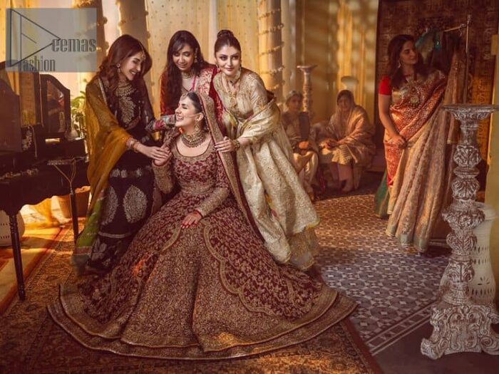 Take me to your heart, for it's there that I belong. A pure outfit base in maroon as a canvas to meticulously designed golden bloomings all over to show the real-time magic of tilla, kora, dabka and zardozi. The round neckline of the traditional pishwas highlighted the incrusted beauty of the outfit. Further, the full sleeve of the following pishwas is wearable art on your big day. It is systemized with a heavy lehenga to give you a more traditional look. Complete this maroon outfit with a dupatta in the same hue having four-sided embellished borders and sequins sprayed all over to show the colour of love.