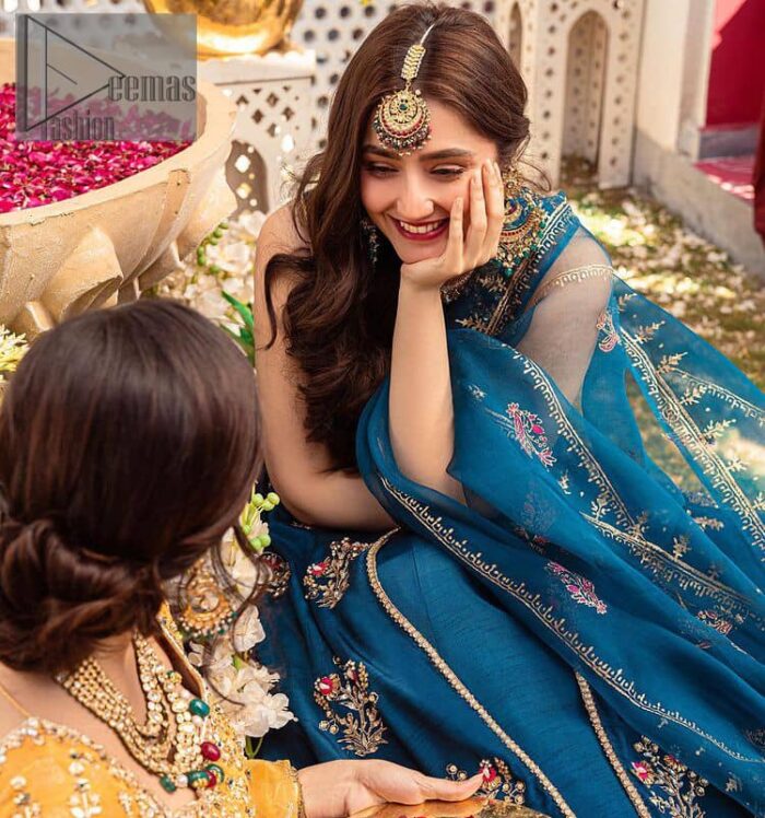 Blue defines your beauty and glows your face at any event.  Starting this article with teal blue front open pishwas that are decorated with handsome golden embroidery placed like floral motifs. It is prominent with tilla, dabka, kora and Kundan to enhance the gold in blue. In addition to this, it is styled with a sleeveless and round neckline to make your day better and the best. The following pishwas are coordinated with a can-can lehenga whose border is again adorned with heavy embellishment  Complete this party look with a teal blue dupatta that is rendered with four-sided borders and floral motifs all over to put a glow on your face.