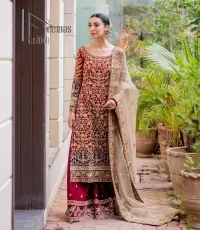 Embrace yourself with deep red on your big day. This deep red long shirt is meticulously hand-rendered with light golden embroidery which is further enhanced with tilla, dabka, kora and zardozi. The boat shape neckline of the long shirt is uniquely designed with full sleeves. This nikah wear is paired up with deep red sharara having embellished borders and ting floral motifs. Complete this nikah wear with a light fawn dupatta having four-sided embellished borders and tiny floral motifs all over to fulfil your dreams for your big day.