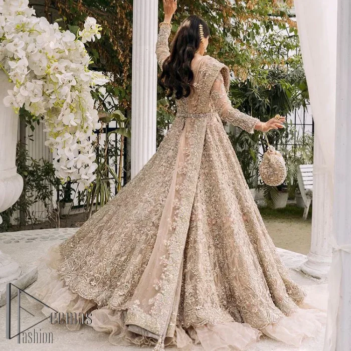 Begin your new life by wearing a dreamy nikah outfit of deemasFashion. Introduce this nikkah outfit with a light fawn frilled heavy maxi that is laboriously hand-rendered with silver and the same colour embroidery that enhances tilla, dabka, kora and crystal. The boat shape neckline and full sleeves of this maxi also add memorable beauty to your amazing Qabool Hai moment. The maxi of this nikah wear is systemized with a dupatta in the same colour which is ornamented with four-sided borders and sequins sprayed all over to enhance the attractiveness of the nikah outfit.