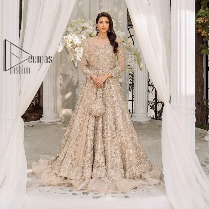 Begin your new life by wearing a dreamy nikah outfit of deemasFashion. Introduce this nikkah outfit with a light fawn frilled heavy maxi that is laboriously hand-rendered with silver and the same colour embroidery that enhances tilla, dabka, kora and crystal. The boat shape neckline and full sleeves of this maxi also add memorable beauty to your amazing Qabool Hai moment. The maxi of this nikah wear is systemized with a dupatta in the same colour which is ornamented with four-sided borders and sequins sprayed all over to enhance the attractiveness of the nikah outfit.