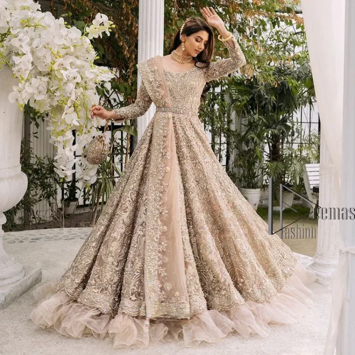 Begin your new life by wearing a dreamy nikah outfit of deemasFashion. Introduce this nikkah outfit with a light fawn frilled heavy maxi that is laboriously hand-rendered with silver and the same colour embroidery that enhances tilla, dabka, kora and crystal. The boat shape neckline and full sleeves of this maxi also add memorable beauty to your amazing Qabool Hai moment. The maxi of this nikah wear is systemized with a dupatta in the same colour which is ornamented with four-sided borders and sequins sprayed all over to enhance the attractiveness of the nikah outfit.