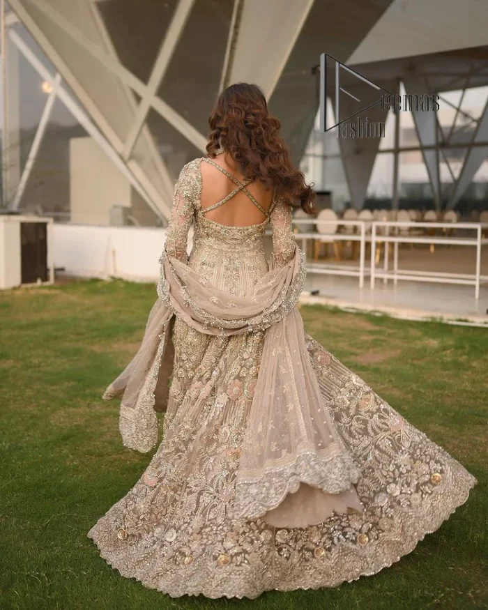 Start your new life by wearing DeemasFashion. Make your moment more memorable with light fawn heavy maxi nikah wear which is laboriously hand-rendered with silver and the same colour embroidery that enhances tilla, dabka, kora and crystal. The boat shape neckline and full sleeves of this maxi also add memorable beauty to your Qabool Hai moment. The maxi of this nikah wear is systemized with a dupatta in the same colour which is ornamented with four-sided borders and sequins sprayed all over to enhance the attractiveness of the nikah wear.